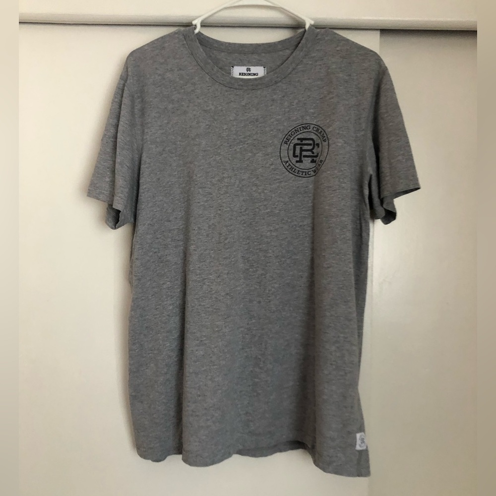 Reigning champs grey T shirt . In good condition